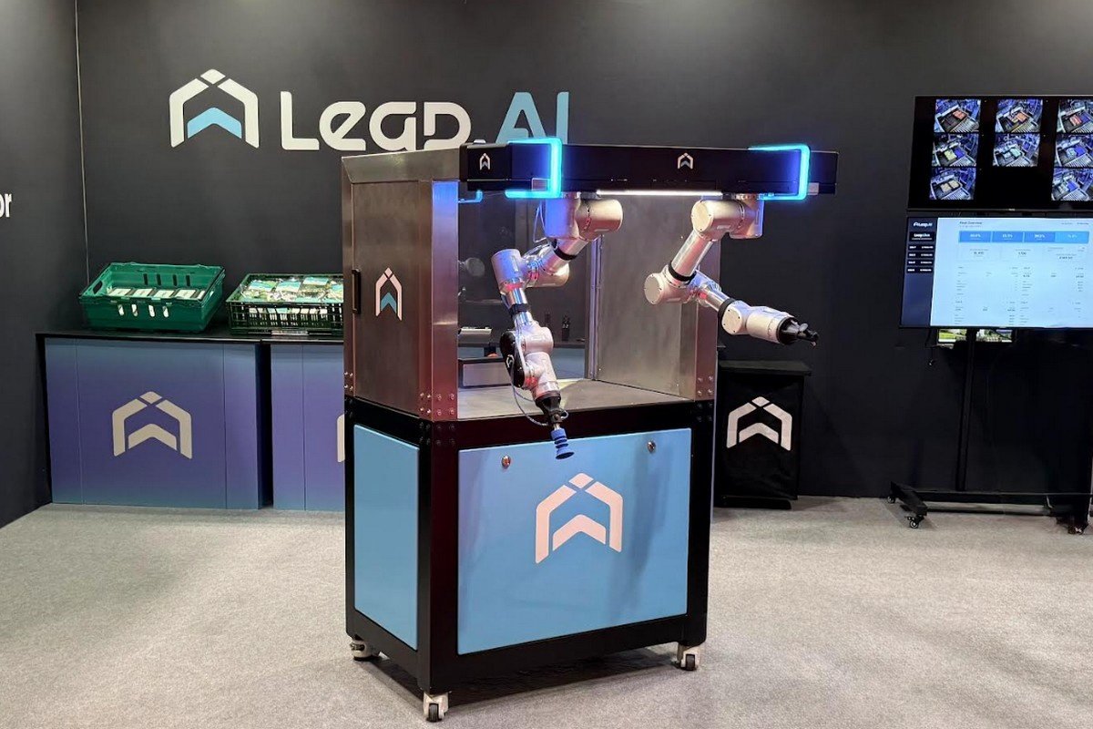 Leap AI robotic handling equipment displayed with two arms and monitoring screens